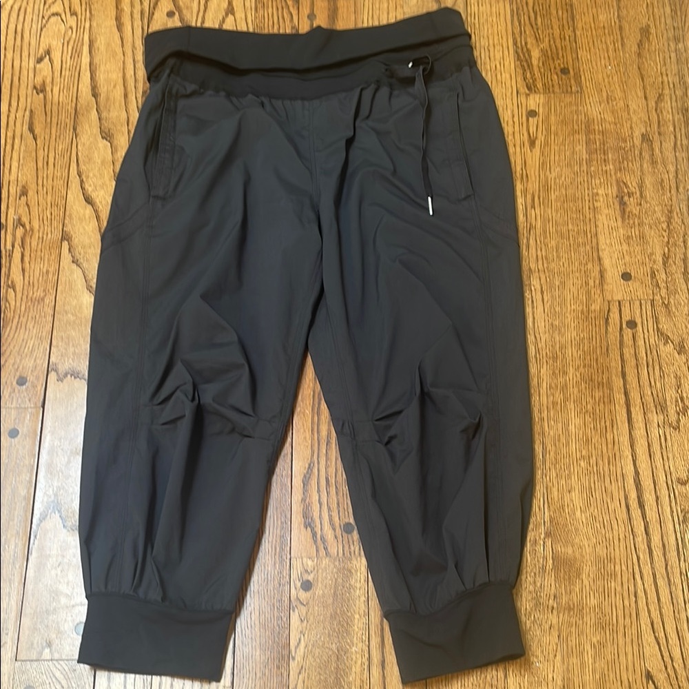 Lululemon sz 10 Black cropped pants wide knit bands side tie-up back zip pocket